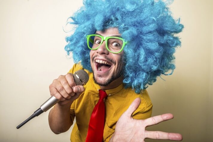 crazy funny young man with blue wig